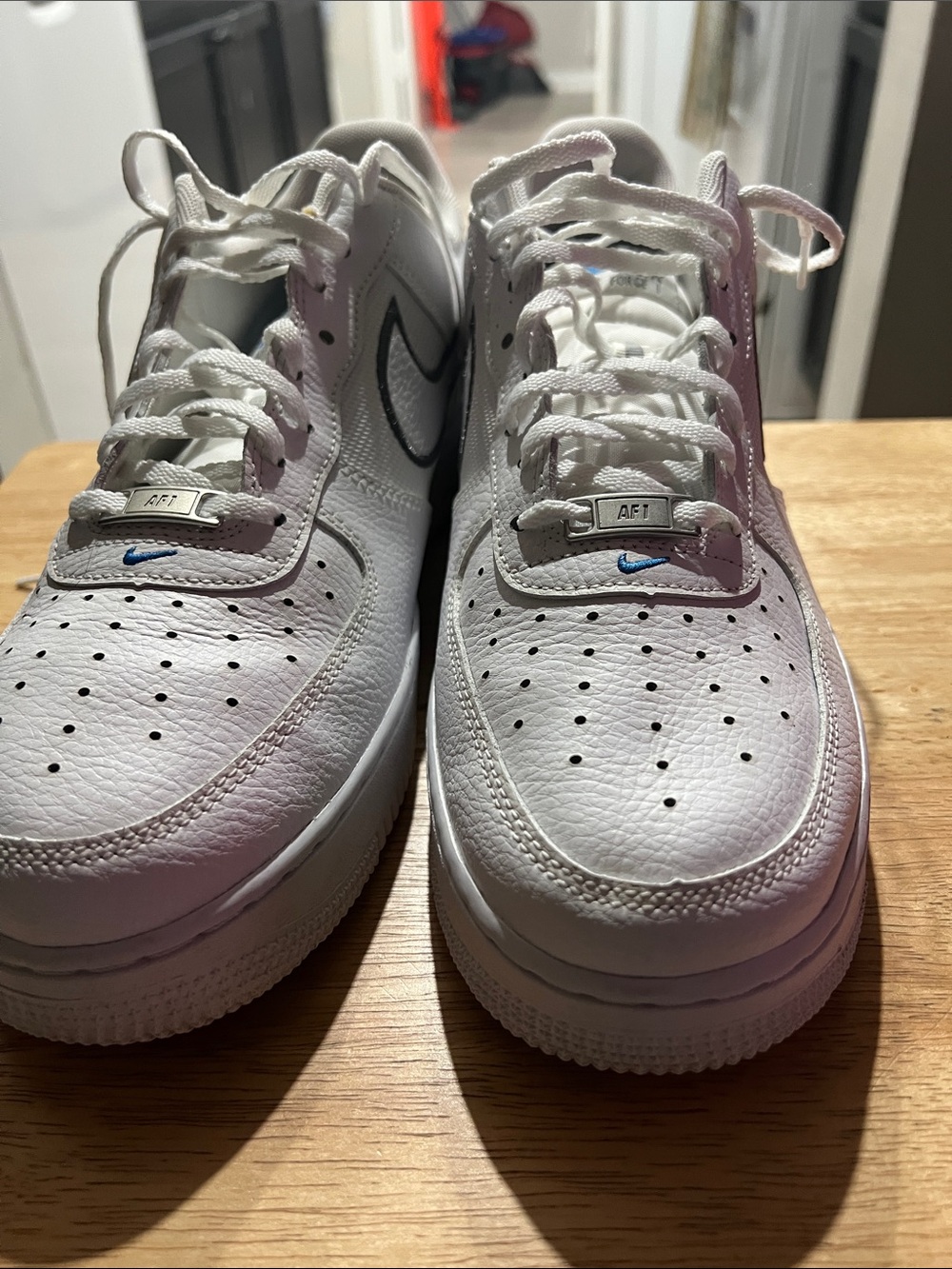 Nike White Leather Sneakers with Small Blue Swoosh